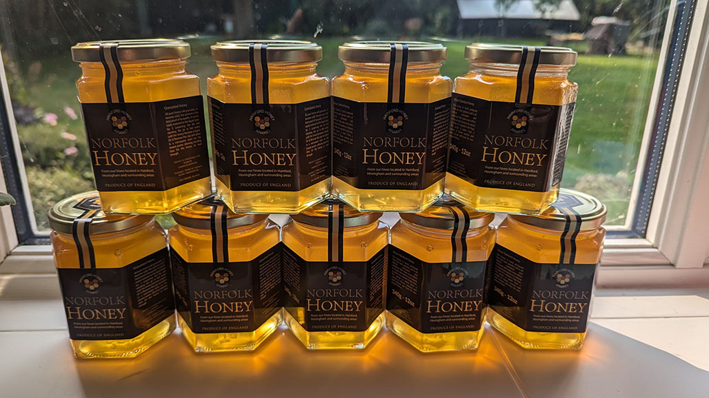 Many buckets filled with harvested honey