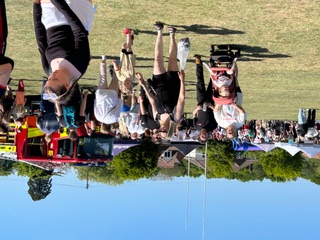 A crowd at the fete with a fire engine in the background